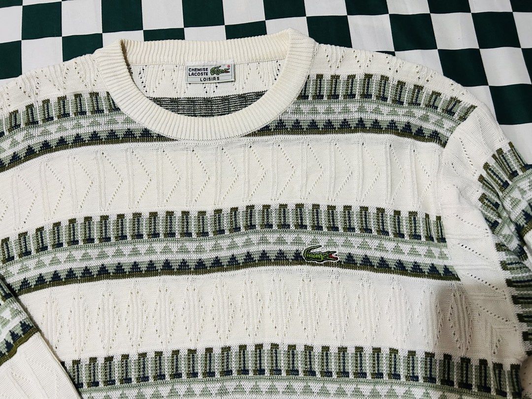 Lacoste Knit Sweater Long Sleeve White Green Pattern (Category: Luxury Apparel) located in Baguio. Submitted by don_ben (Listing ID 1445184619, Image 2). Description: Classic white Lacoste sweater with green geometric pattern. Features cable knit, crew neck, long sleeves, and embroidered crocodile logo. Dimensions:20x25.5.