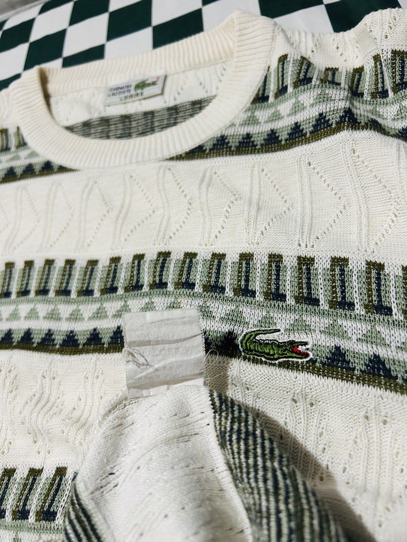 Lacoste Knit Sweater Long Sleeve White Green Pattern (Category: Luxury Apparel) located in Baguio. Submitted by don_ben (Listing ID 1445184619, Image 3). Description: Classic white Lacoste sweater with green geometric pattern. Features cable knit, crew neck, long sleeves, and embroidered crocodile logo. Dimensions:20x25.5.