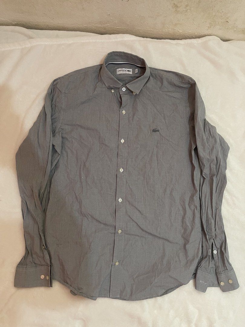 Lacoste Slim Fit Button Down Shirt Grey Size 40 (Category: Tshirts & Polo Shirts ) located in Tuguegarao City. Submitted by elyks11 (Listing ID 1445077518, Image 1). Description: - Brand: Lacoste - Color: Grey - Fit: Slim Fit - Size: 40 - Material: 100% Cotton - Origin: Made in Argentina - Features: Embroidered Lacoste crocodile logo on chest, button cuffs - Style: Smart casual wear.