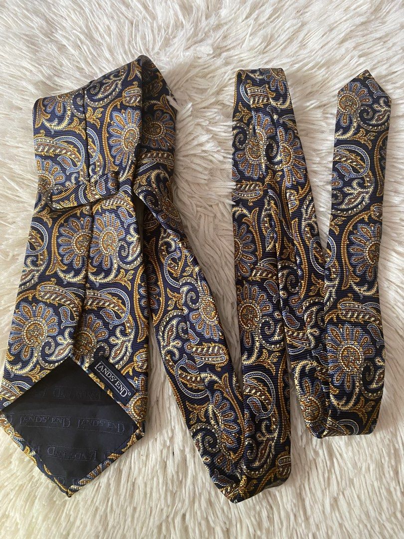 Lands' End Paisley Silk Tie (Category: Ties) located in Bulacan. Submitted by rich2545 (Listing ID 1445087123, Image 3). Description: - Classic paisley tie from Lands' End - Rich navy blue base - Intricate gold and blue floral patterns - Made of 100% silk - Ideal for formal or business casual occasions - Adds a stylish pop of color.