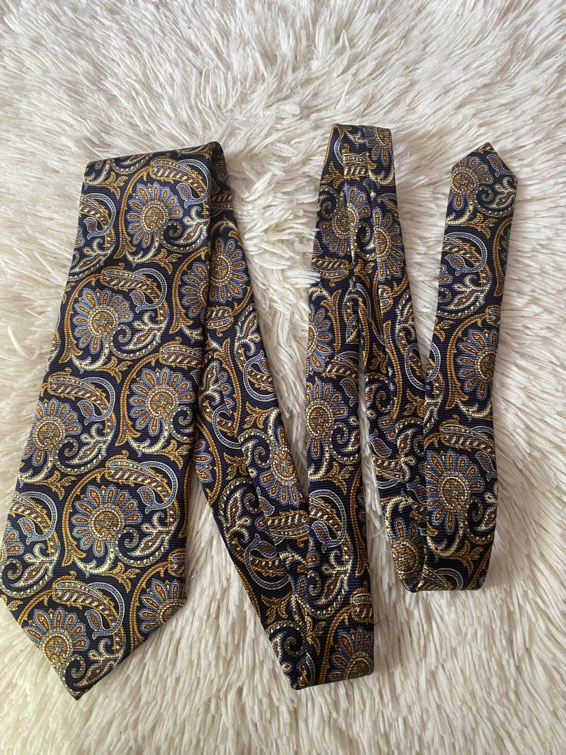 Lands' End Paisley Silk Tie (Category: Ties) located in Bulacan. Submitted by rich2545 (Listing ID 1445087123, Image 1). Description: - Classic paisley tie from Lands' End - Rich navy blue base - Intricate gold and blue floral patterns - Made of 100% silk - Ideal for formal or business casual occasions - Adds a stylish pop of color.
