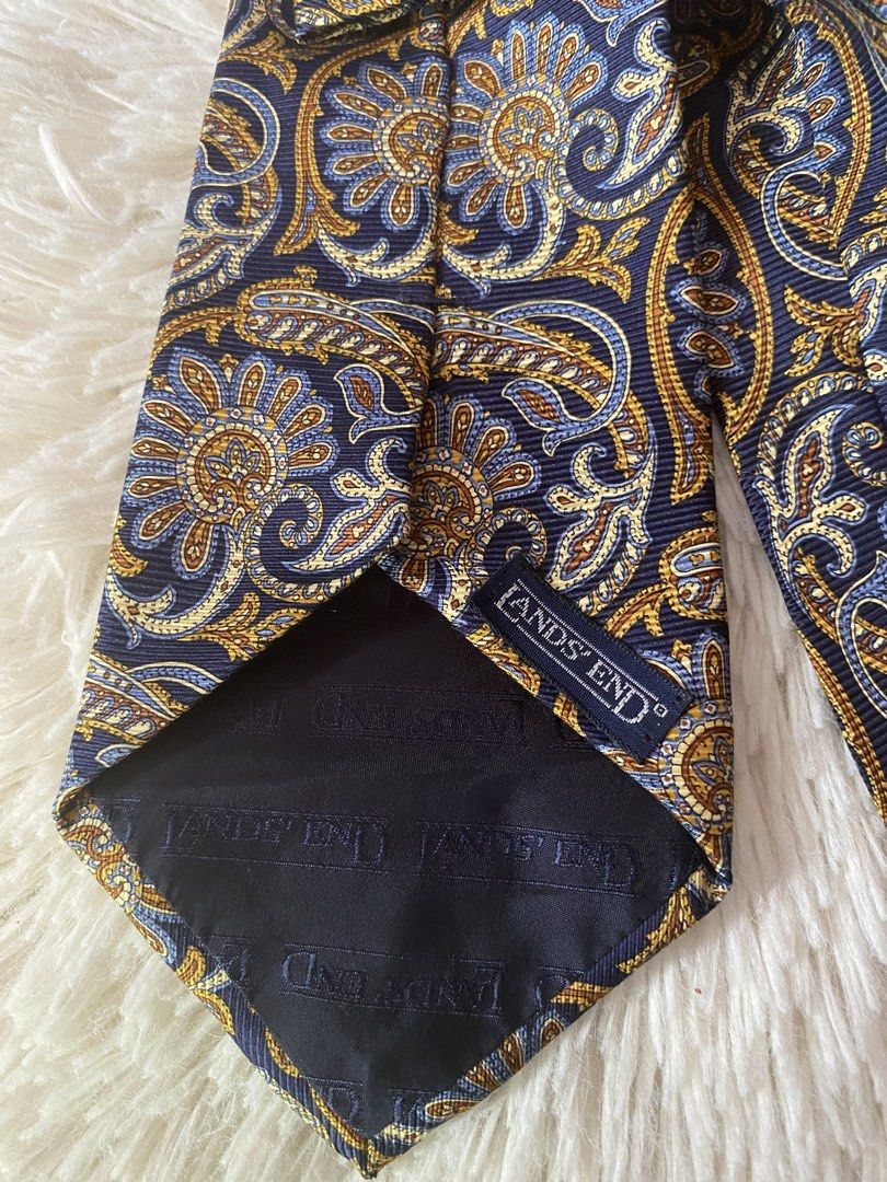 Lands' End Paisley Silk Tie (Category: Ties) located in Bulacan. Submitted by rich2545 (Listing ID 1445087123, Image 2). Description: - Classic paisley tie from Lands' End - Rich navy blue base - Intricate gold and blue floral patterns - Made of 100% silk - Ideal for formal or business casual occasions - Adds a stylish pop of color.