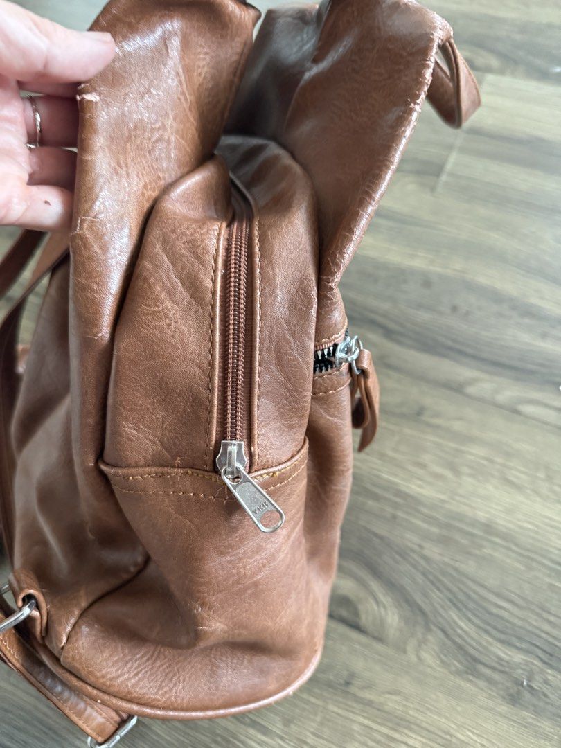 Leather backpack (Category: Backpacks) located in Georgetown. Submitted by celine_violet (Listing ID 1445047430, Image 3). Description: Bought this from Austria few years ago. Kept in wardrobe . Side peeling as you can see from the picture . Other than this. All is good condition. Soft leather back pack , convertible to shoulder as well .