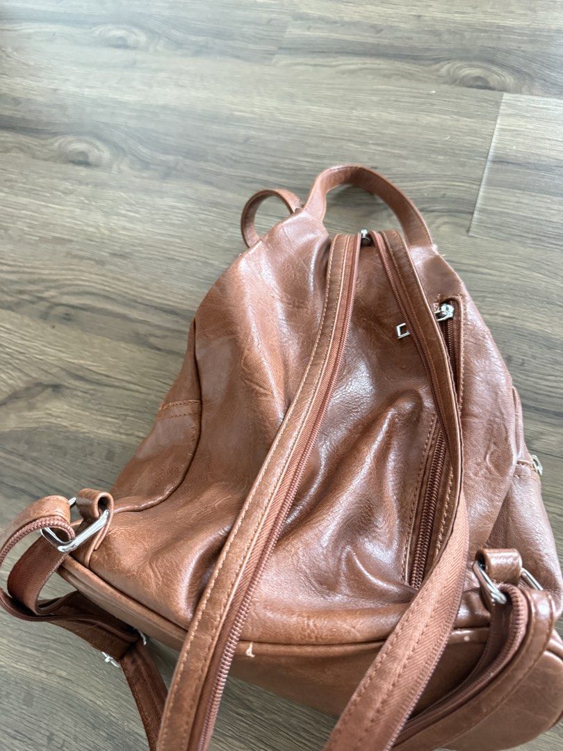 Leather backpack (Category: Backpacks) located in Georgetown. Submitted by celine_violet (Listing ID 1445047430, Image 2). Description: Bought this from Austria few years ago. Kept in wardrobe . Side peeling as you can see from the picture . Other than this. All is good condition. Soft leather back pack , convertible to shoulder as well .