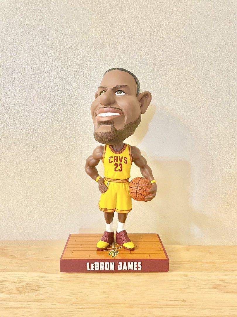 LeBron James Cavaliers Caricature Bobblehead (Category: Figurines & Statues) located in Paranaque City. Submitted by desayer02 (Listing ID 1445218270, Image 1). Description: LeBron James caricature bobblehead in his Cleveland Cavaliers jersey. Number 23 on the back. Stands on a basketball court base with his name. Great collectible for any basketball fan. Perfect for display on a shelf or desk. It was manufactured and /2017 made by Forever Collec