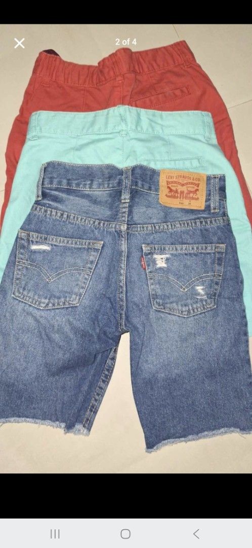 Levi's Denim Shorts & 2 old navy (Category: Babies & Kids Fashion) located in Cavite. Submitted by 92939494959597 (Listing ID 1445053442, Image 2). Description: - Bundle of 3 boys' shorts - Includes: 1 pair distressed Levi's denim shorts (raw hem), 1 teal chino shorts, 1 red chino shorts - Ideal for summer wear.
