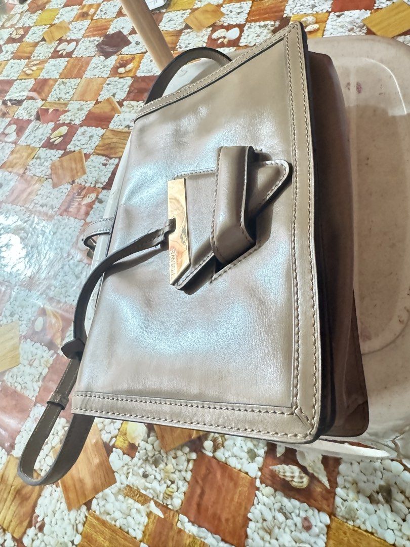 Loewe Puzzle Bag Tan Leather (Category: Luxury Bags & Wallets) located in Manila. Submitted by wildbear.e10374 (Listing ID 1445063100, Image 2). Description: - Authentic Loewe bag - Color: Tan - Material: Leather - Made in Spain - Includes shoulder strap - Multiple interior compartments - Gold hardware.