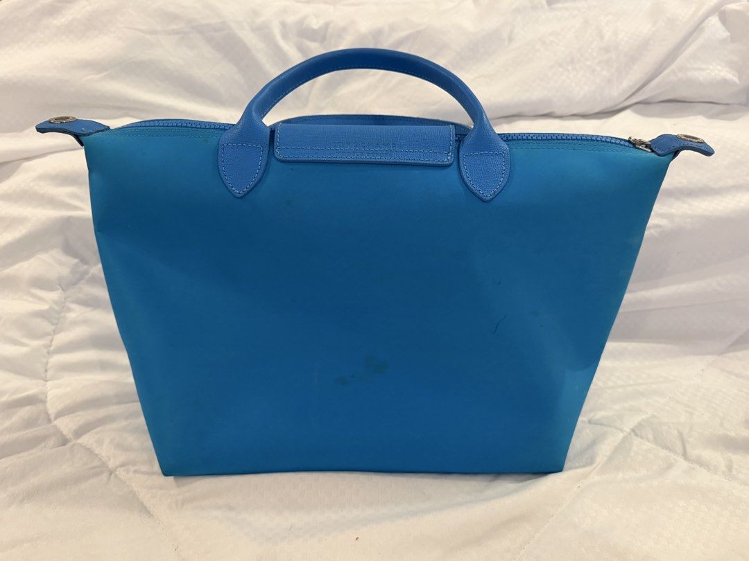 Longchamp Le Pliage Neo Shoulder Bag Blue (Category: Luxury Bags & Wallets) located in Cavite. Submitted by cloudbar99 (Listing ID 1445063351, Image 3). Description: Read for details! (^0^)/ - AUTHENTIC Blue Longchamp Le Pliage Neo bag - Durable nylon body with genuine leather handles and trim - Sleek silver hardware - Detachable shoulder strap included - Minor signs of wear visible in photos - Secure top zipper closure Reasons for selling: declu