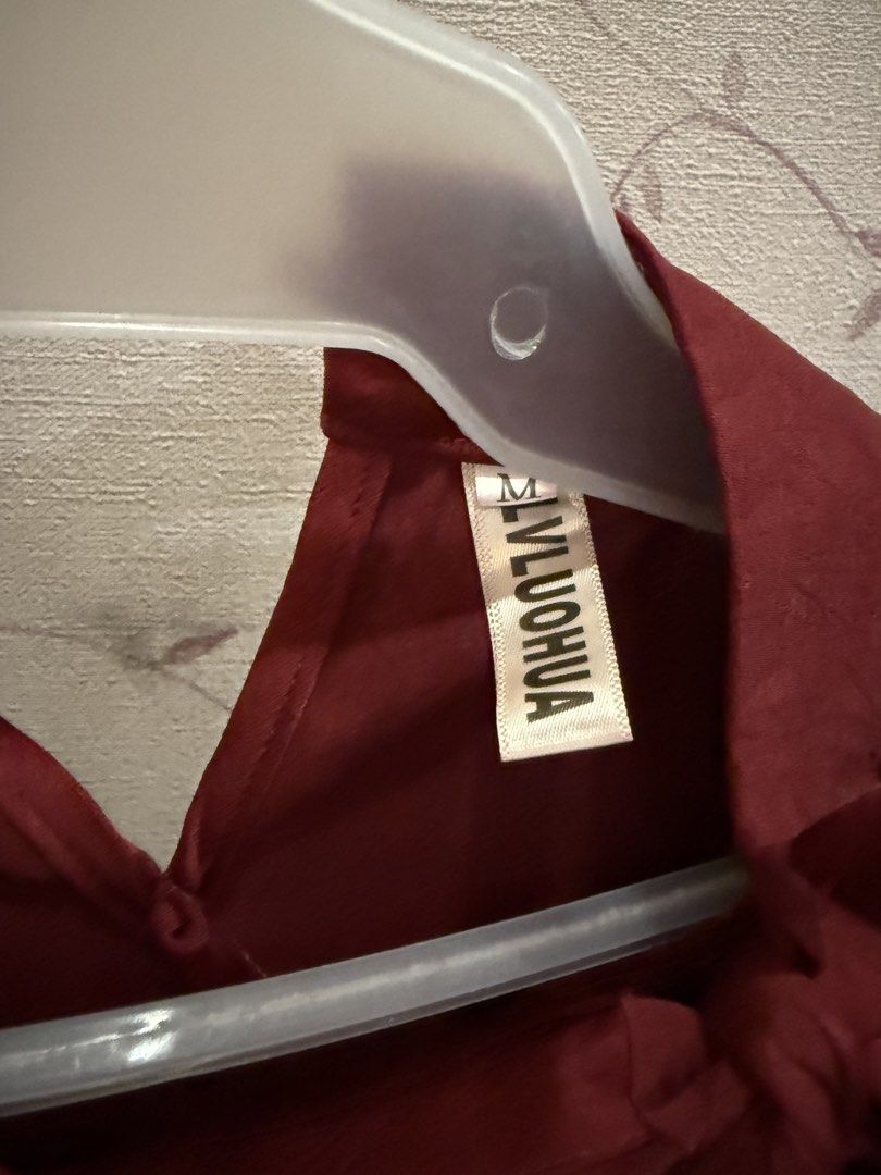 Maroon Sleeveless Top with Tie Neck - Size M (Category: Sleeveless) located in Manila. Submitted by thewildfinders (Listing ID 1445164502, Image 2). Description: - Sleeveless maroon top - Features a stylish tie detail at the neck - Material has a subtle sheen - Perfect for both casual and dressy outfits.