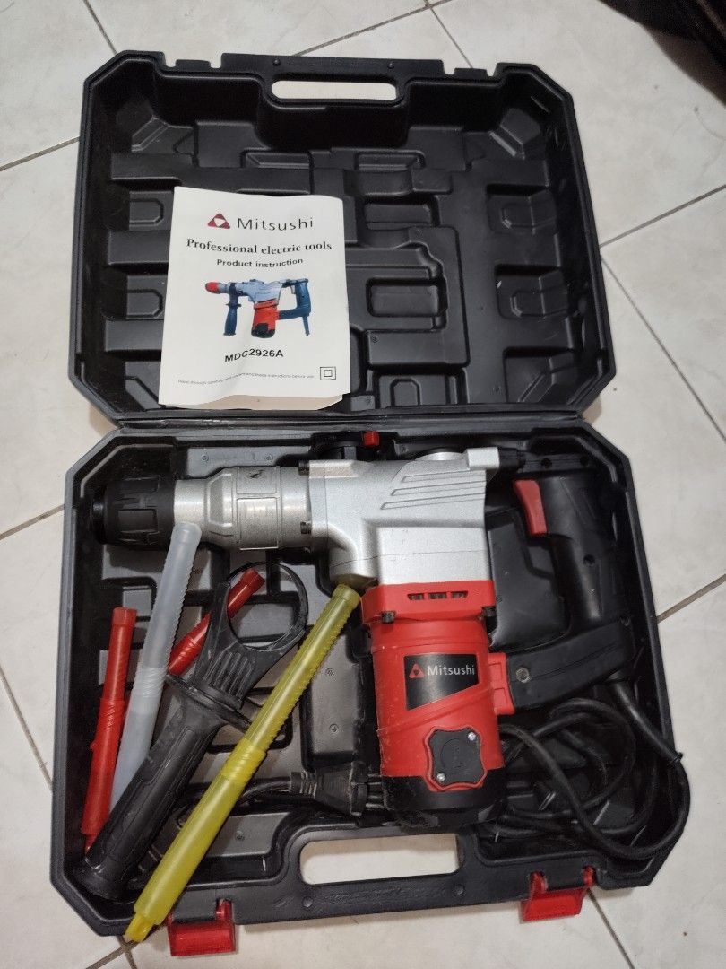 Mitsubishi Rotary Hammer Drill with Case (Category: Construction Tools & Equipment) located in Las Pinas. Submitted by selling.good.stuff27 (Listing ID 1445106555, Image 2). Description: - Mitsubishi Rotary Hammer Drill - Includes sturdy carrying case - Comes with accessories and instruction manual - Ideal for demolition and drilling tasks - Ready for your next project.