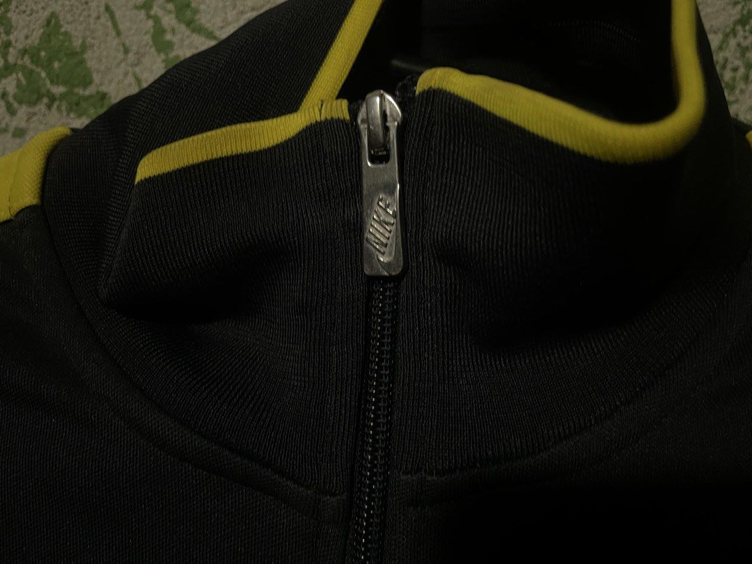 Nike FC Barcelona Track Jacket (Category: Coats, Jackets and Outerwear) located in Manila. Submitted by jofferpari63571 (Listing ID 1445200805, Image 3). Description: - Authentic Nike track jacket - Features FC Barcelona crest - Black and yellow colorway - Full zip closure - Nike swoosh logo - Ideal for football enthusiasts.