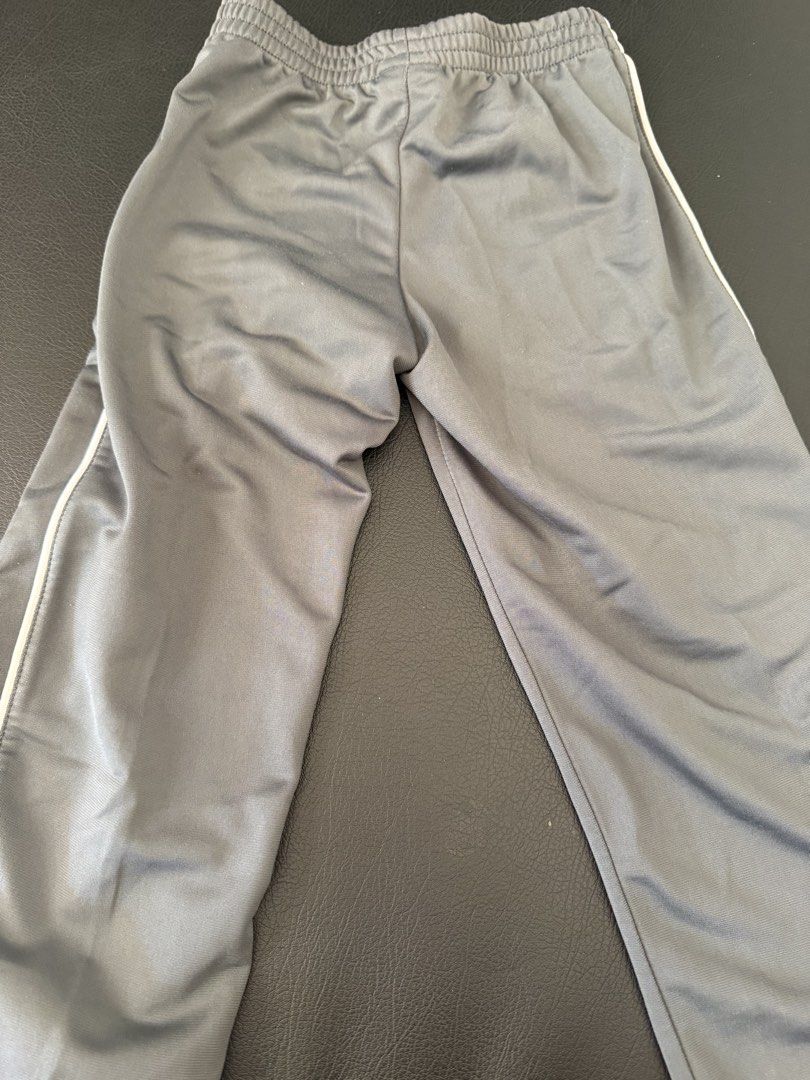Nike Grey Track Pants with White Stripes (Category: Babies & Kids Fashion) located in Bulacan. Submitted by emjay_17 (Listing ID 1445050346, Image 3). Description: - Grey Nike track pants - White stripe detail on sides - Elastic waistband for comfort - Made in Thailand - Ideal for sports or casual outfits.