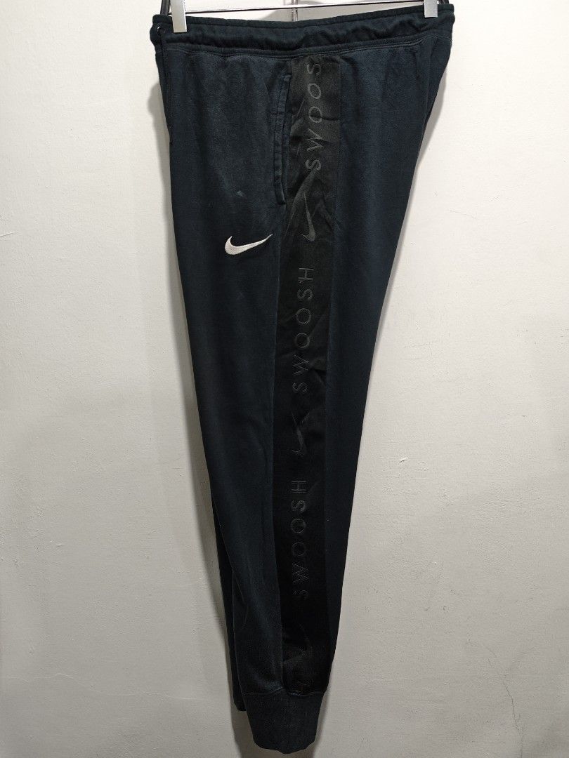 Nike Swoosh Track Pants Jogger (Category: Joggers) located in Bulacan. Submitted by pzj_thrift (Listing ID 1445207625, Image 1). Description: Nike side tape jogger L 37.5 W 31-36 Condition 9/10 Color rate 9/10 Issue small stain.