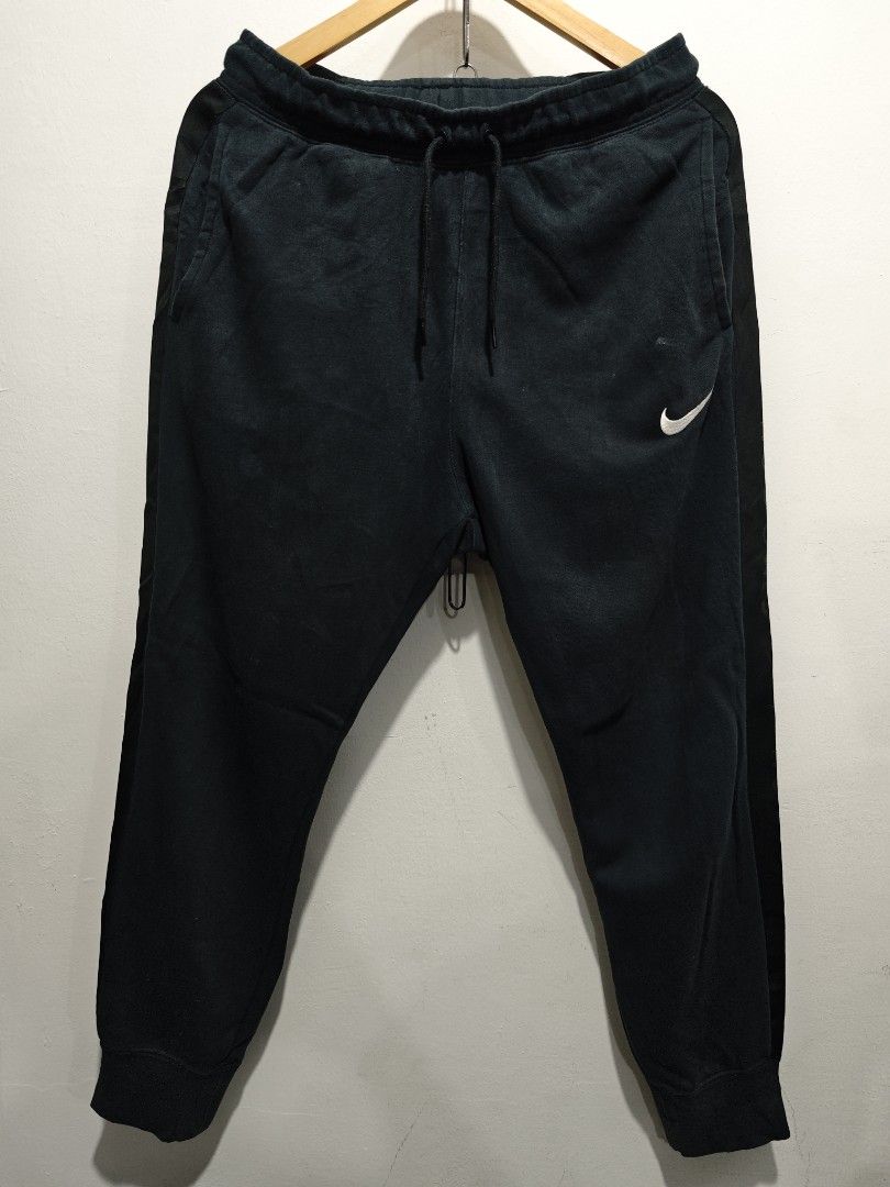 Nike Swoosh Track Pants Jogger (Category: Joggers) located in Bulacan. Submitted by pzj_thrift (Listing ID 1445207625, Image 2). Description: Nike side tape jogger L 37.5 W 31-36 Condition 9/10 Color rate 9/10 Issue small stain.