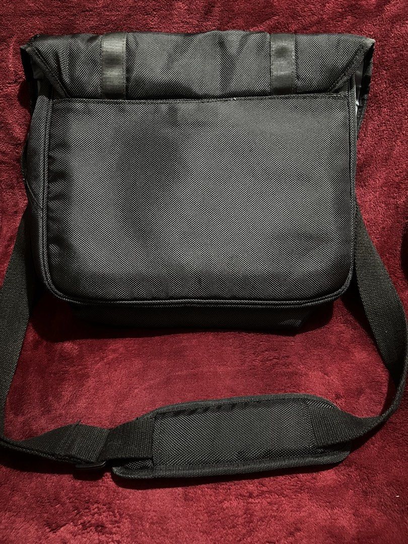 Nikon Black Messenger Camera Bag (Category: Camera Bags & Carriers) located in La Trinidad. Submitted by whatnotcollections (Listing ID 1445177776, Image 2). Description: - Black Nikon messenger bag - Padded shoulder strap for comfort - Thick foam padding on the main compartment. - Front flap with two buckle closures - Durable material - Ideal for camera gear or everyday essentials. - Inside detachable dividers not included. - Can also be used as