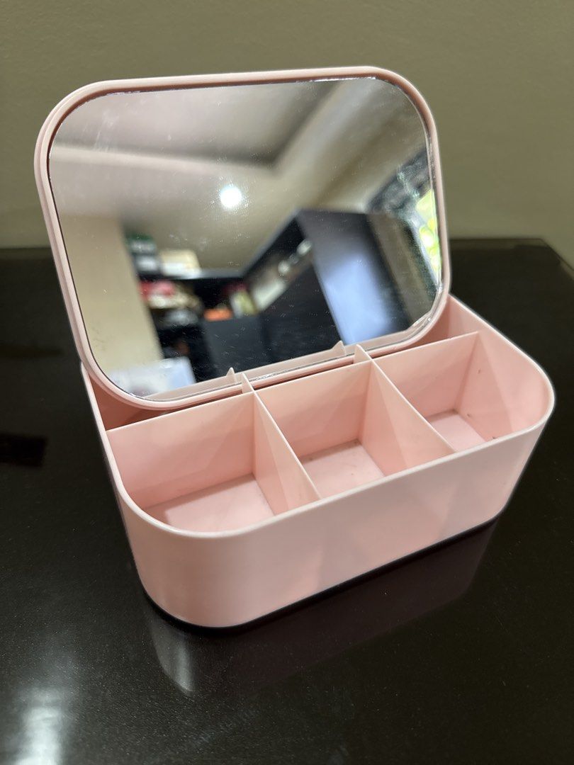 Pink Makeup Organizer Box with Mirror and Compartments (Category: Makeup) located in Bacoor. Submitted by yoonkibox (Listing ID 1445064795, Image 1). Description: Cute pink organizer box with mirror. Keeps makeup tidy with multiple compartments. Lid closes to prevent dust. Perfect for vanities..