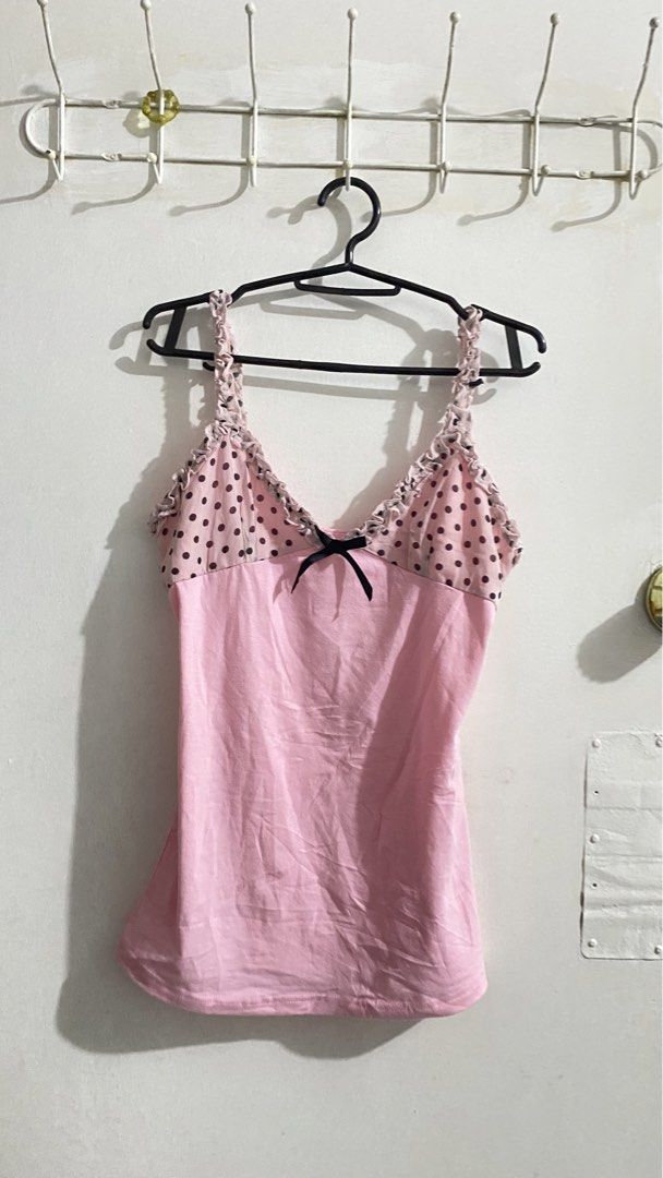 Pink Polka Dot Cami Top with Ruffle Trim (Category: Sleeveless) located in Iloilo. Submitted by kumiyuiz (Listing ID 1445190460, Image 1). Description: mine — 150 steal — 250 lock — 450(au) - Adorable pink camisole - Polka dot overlay on the bust - Sweet black bow detail - Ruffled trim along neckline and straps - Adjustable spaghetti straps - Perfect for layering or standalone wear.