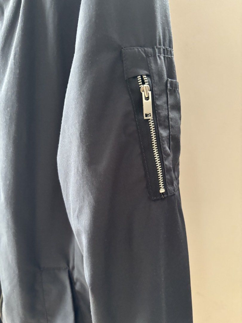 Pull&Bear Bomber Jacket (Category: Coats, Jackets and Outerwear) located in Singapore. Submitted by kitty_loo4572 (Listing ID 1445061495, Image 3). Description: - Brand: Pull&Bear - Color: Dark Navy - Style: Bomber Jacket - Closure: Zip-up front - Pockets: Zipped pocket on left sleeve, two side pockets - Occasion: Casual wear - Styling: Easy to style.