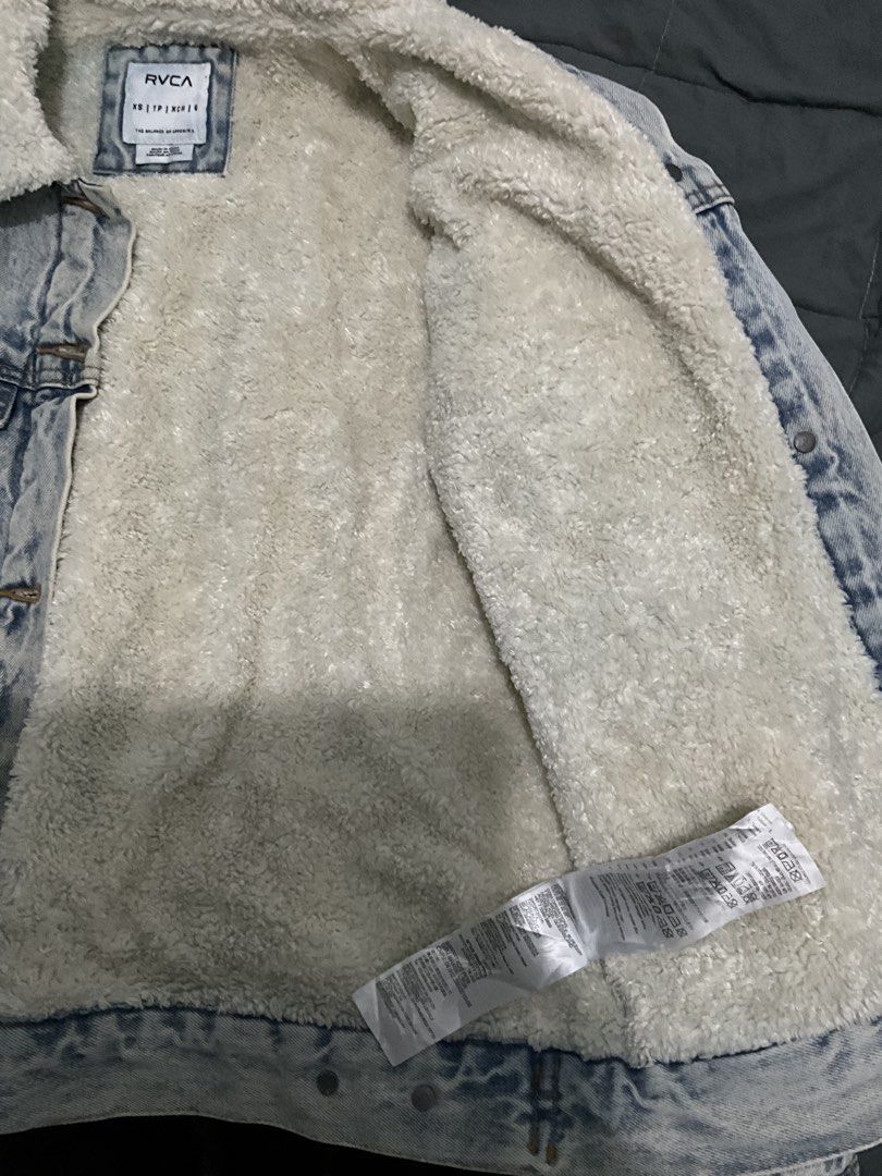 RVCA Acid Wash Sherpa Lined Denim Jacket (Category: Coats, Jackets and Outerwear) located in Manila. Submitted by djiiie (Listing ID 1445191606, Image 2). Description: - RVCA Acid Wash Denim Jacket - Cozy Sherpa Lining for Warmth - Classic Trucker Jacket Design - Button-Up Closure - Two Chest Pockets - Two Side Pockets - Ideal for Casual Wear in Cooler Weather.