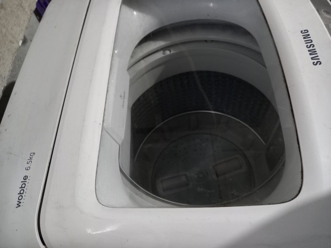 Samsung Wobble Technology Washing Machine 6.5kg (Category: Washing Machines and Dryers) located in Taytay. Submitted by decluttering_is_fun_by_dr_a (Listing ID 1445087900, Image 2). Description: - Samsung Top Load Washing Machine - 6.5kg Capacity - Features Wobble Technology for gentler fabric care - Multiple wash cycle options on control panel - Clean and ready to use drum - Ideal for small to medium-sized households .