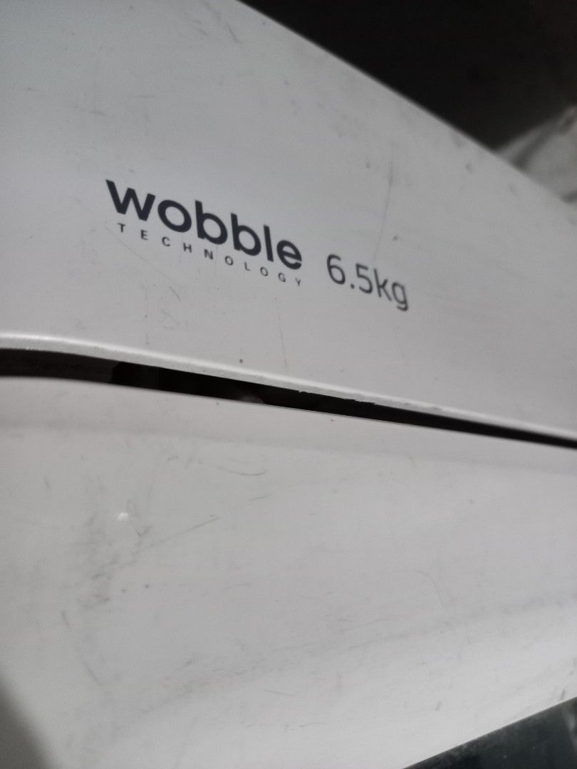 Samsung Wobble Technology Washing Machine 6.5kg (Category: Washing Machines and Dryers) located in Taytay. Submitted by decluttering_is_fun_by_dr_a (Listing ID 1445087900, Image 3). Description: - Samsung Top Load Washing Machine - 6.5kg Capacity - Features Wobble Technology for gentler fabric care - Multiple wash cycle options on control panel - Clean and ready to use drum - Ideal for small to medium-sized households .