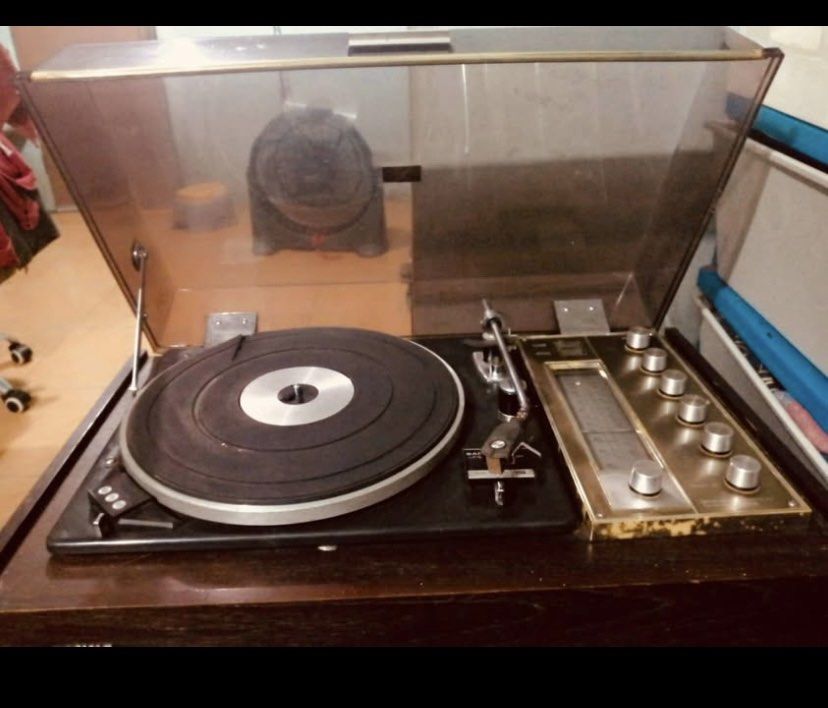Sanyo Record Player Turntable model DC-534 (Category: Portable Music Players) located in Manila. Submitted by cosmiccloud-adf7 (Listing ID 1445122216, Image 2). Description: - Vintage Sanyo record player - Built-in radio function - Turntable spins and is operational - All original knobs and buttons intact - Clear plastic lid - Classic wood grain casing - Perfect for playing your vinyl records - A great collectible for music enthusiasts.