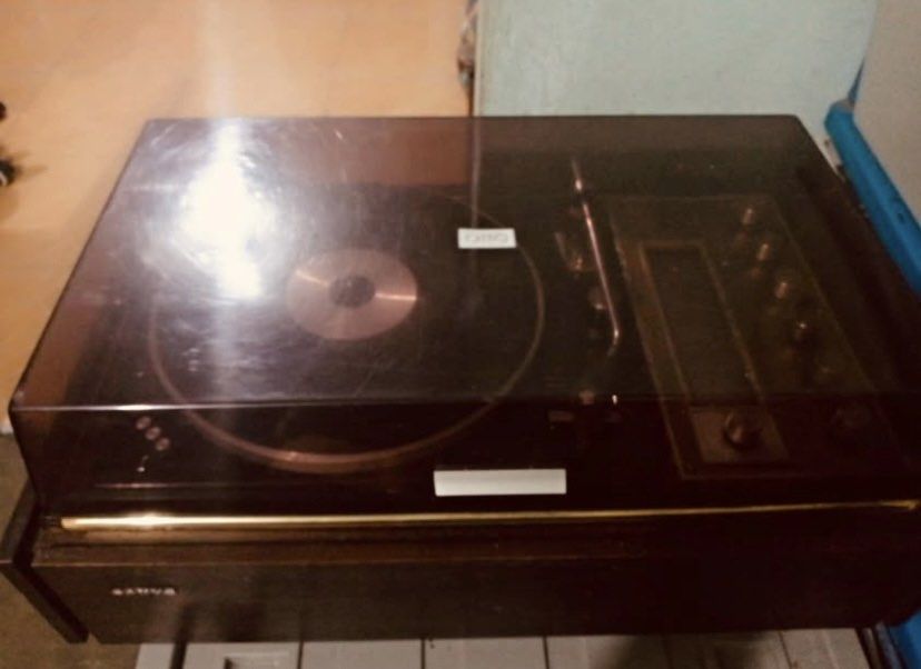 Sanyo Record Player Turntable model DC-534 (Category: Portable Music Players) located in Manila. Submitted by cosmiccloud-adf7 (Listing ID 1445122216, Image 3). Description: - Vintage Sanyo record player - Built-in radio function - Turntable spins and is operational - All original knobs and buttons intact - Clear plastic lid - Classic wood grain casing - Perfect for playing your vinyl records - A great collectible for music enthusiasts.