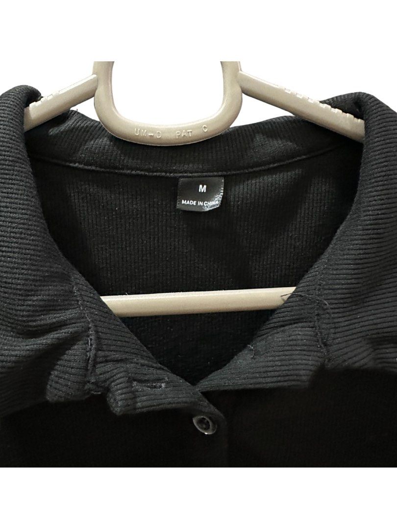 Shein Black Cropped Polo Shirt (Medium) (Category: Others Tops) located in Manila. Submitted by goodfindsmnl_ (Listing ID 1445100585, Image 2). Description: - Shein black polo shirt - Size: Medium - Good condition - Clean, no flaws.