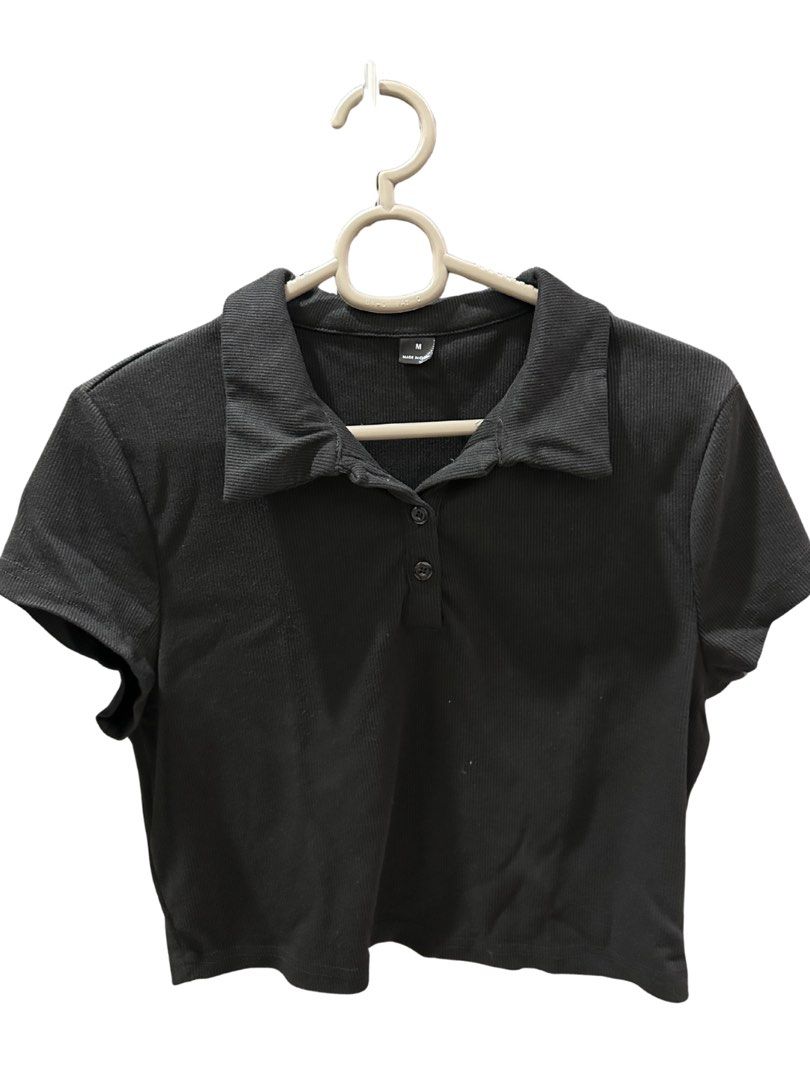 Shein Black Cropped Polo Shirt (Medium) (Category: Others Tops) located in Manila. Submitted by goodfindsmnl_ (Listing ID 1445100585, Image 1). Description: - Shein black polo shirt - Size: Medium - Good condition - Clean, no flaws.
