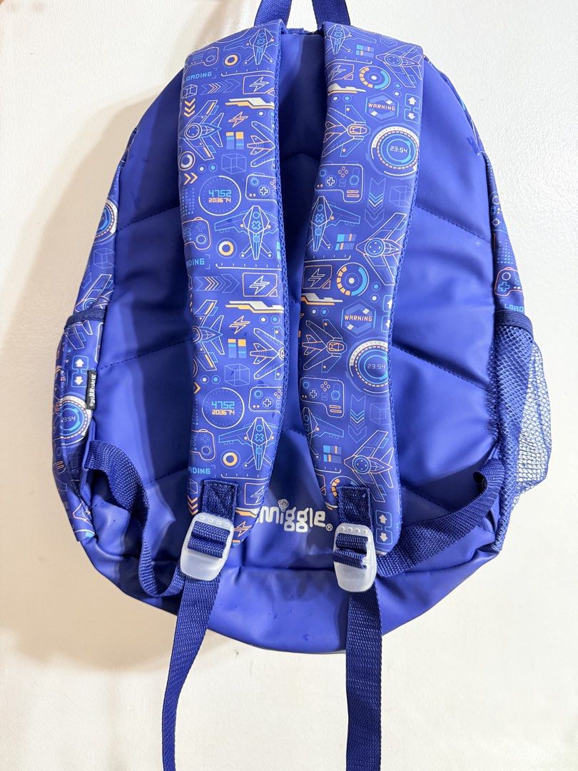Smiggle Blue Gaming Controller Backpack (Category: Backpacks) located in Manila. Submitted by thedigital28748 (Listing ID 1445055170, Image 2). Description: - Cool blue Smiggle backpack - Fun gaming controller design on front pocket - Spacious interior for books and essentials - Comfortable padded shoulder straps - Convenient side mesh pocket for water bottle - Ideal for kids who love gaming.
