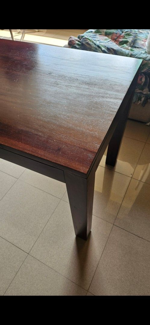 Solid Wood Dining Table (Category: Tables & Sets) located in Singapore. Submitted by KellyRR (Listing ID 1445091498, Image 2). Description: Teak wood table. Dimensions: 47 inch (L) by 28 inch (B) by 31 inch (H) Lightly used. Good condition. Can sit 4 people comfortably. No chair included. Used as a secondary table to our dining table. Selling as no longer needed as we moved and only needed 1 dining table. .