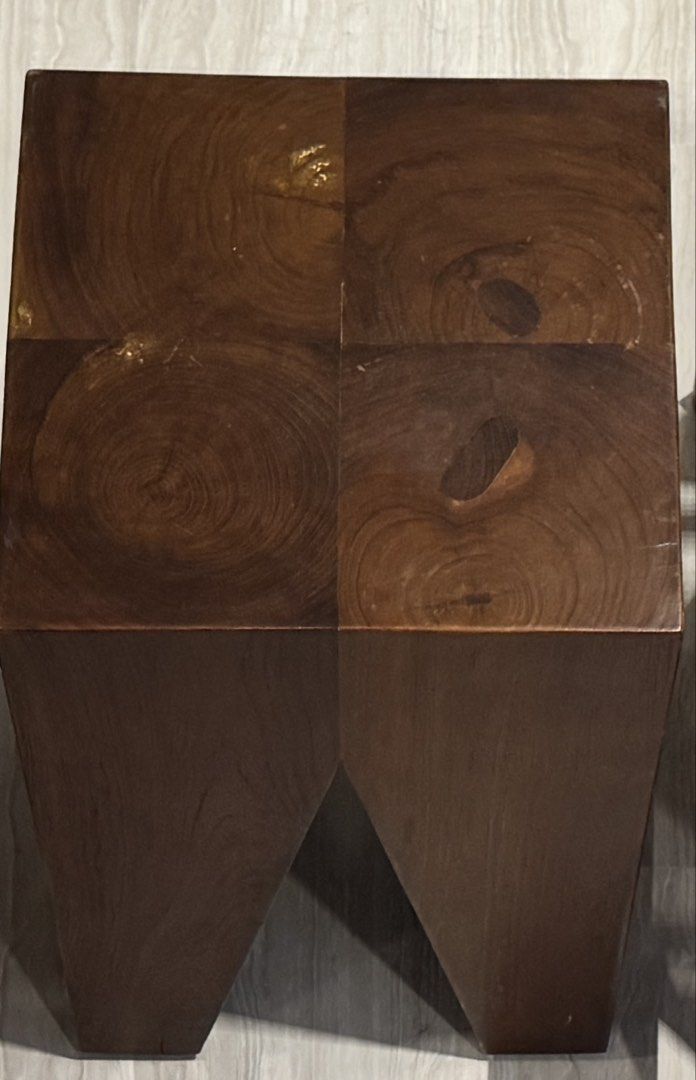 Solid Wood Stool Side Table (Category: Tables & Sets) located in Singapore. Submitted by fishbook (Listing ID 1445169467, Image 2). Description: - Solid teak wood - Unique geometric design - Versatile: use as a side table or extra seating - Natural wood grain patterns - Dark brown finish - Sturdy and durable - 34.5 x 34.5 x 47cm - One for $70, two for $120.