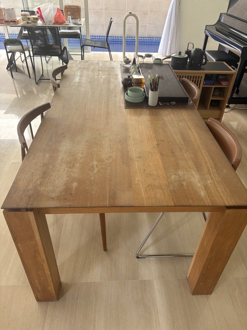 Solid wood table (Category: Tables & Sets) located in Singapore. Submitted by swiftfish.e0bbde (Listing ID 1445069289, Image 3). Description: An elegant and simple wooden table, Length:2 m ,width:1 m The tabletop shows signs of use. As it is made of solid wood, it can be polished or covered with placemats. 2 wooden Chairs ：$30， 2 Leather chairs: $35 Tea tray and Side tea tables are priced .separately..