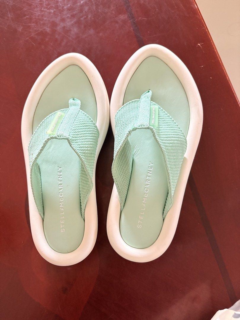 Stella McCartney Mint Green Platform Flip Flops Sandals Size 36 (Category: Sneakers & Footwear) located in Tarlac. Submitted by therusticaddict (Listing ID 1445085176, Image 2). Description: - Stella McCartney flip flops - Color: Mint Green - Size: 36 - Features: Platform sole with white trim - Condition: Good, with minor scuffs on soles from normal wear - Style: Comfortable and stylish for everyday wear.
