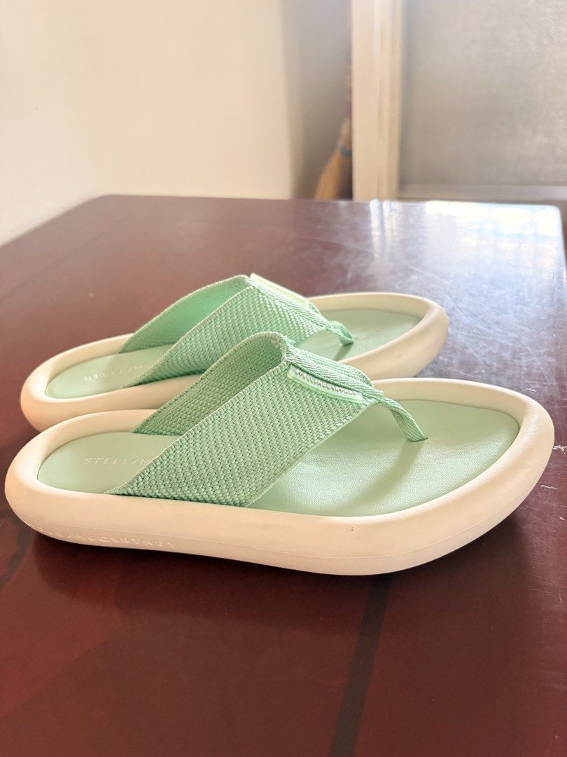 Stella McCartney Mint Green Platform Flip Flops Sandals Size 36 (Category: Sneakers & Footwear) located in Tarlac. Submitted by therusticaddict (Listing ID 1445085176, Image 3). Description: - Stella McCartney flip flops - Color: Mint Green - Size: 36 - Features: Platform sole with white trim - Condition: Good, with minor scuffs on soles from normal wear - Style: Comfortable and stylish for everyday wear.