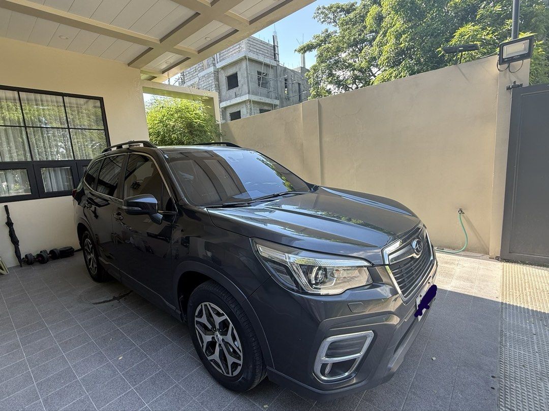 Subaru Forester 2.0 i (A) (Category: Used Cars) located in Quezon City. Submitted by MayO. (Listing ID 1445102231, Image 3). Description: Selling Subaru Forester 2.0i-l 2019 AWD AT 1st owned-DIRECT seller Dark gray metallic Gasoline Push start button MG square italian leather line Still insured until june 2027- PhilBritish New Michelin tires-estimated less than 5,000kms Tools and jack included NEVER NABAHA and BANGA! Original paint(whole body) Is