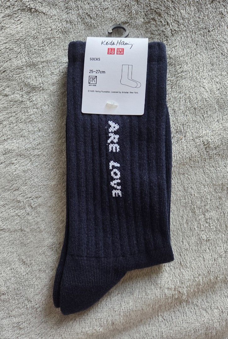 Uniqlo x Keith Haring Navy Socks (Category: Socks) located in Quezon City. Submitted by licotie (Listing ID 1445114431, Image 1). Description: - Uniqlo Keith Harring Collaboration Socks - Color: Navy Blue - Texture: Ribbed - Size: 25-27cm - Made in China.