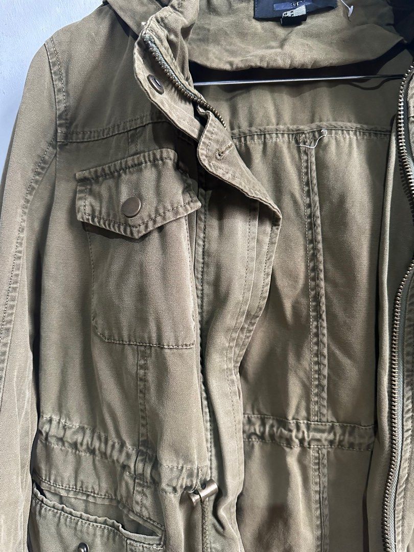 Utility Jacket (Category: Coats, Jackets and Outerwear) located in Quezon City. Submitted by janey.frank.olaivar (Listing ID 1445060021, Image 2). Description: Fits xs-s Detachable hoodie tags: jacket, army green, utility, pockets.
