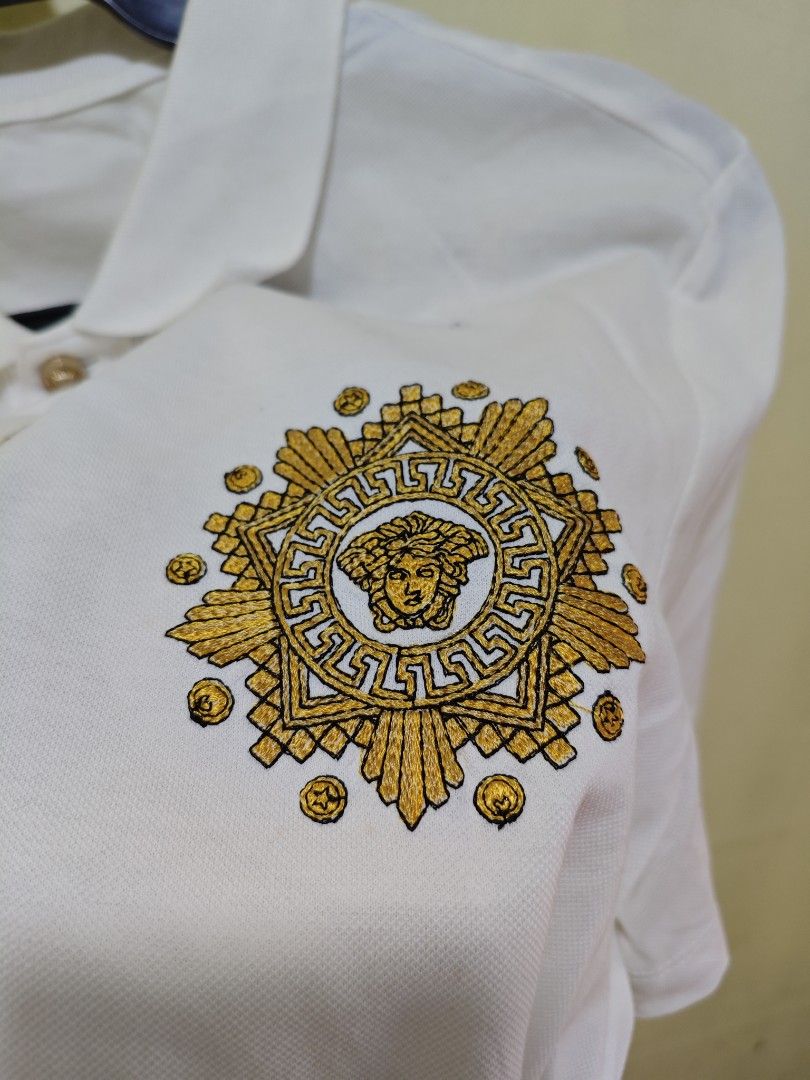 Versace White Classic Men Polo Shirt (Category: Everything Else Others) located in Baguio. Submitted by jayjay_apparel01 (Listing ID 1445077591, Image 3). Description: Versace White Classic Men Polo Shirt Color Rate 9.8/10 Like New Embroidered Logo Flaw Stains Cut Tags Makapal Tela Need Wash Size Medium Dimes 19 Width 26 Length Price P299.