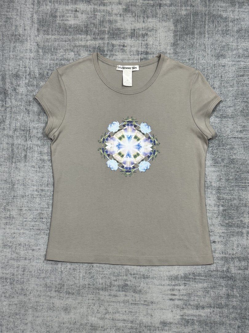 Vivienne Tam - Sleeveless Tops (Category: Sleeveless) located in Manila. Submitted by members-only (Listing ID 1445182111, Image 1). Description: Vivienne Tam Sleeveless Tops Symmetrical Floral Graphic Size: 2 Dimes: 17 x 22 Very good condition No issue.