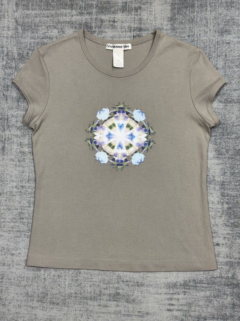 Vivienne Tam - Sleeveless Tops (Category: Sleeveless) located in Manila. Submitted by members-only (Listing ID 1445182111, Image 2). Description: Vivienne Tam Sleeveless Tops Symmetrical Floral Graphic Size: 2 Dimes: 17 x 22 Very good condition No issue.