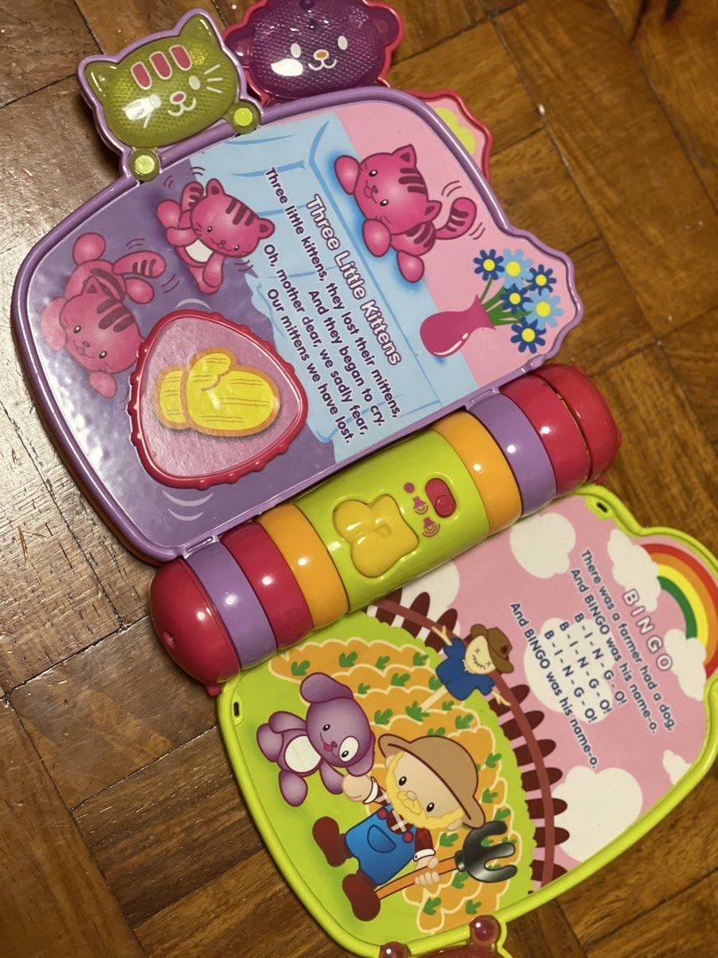 VTech Interactive Rhyme & Discover Book - Musical Learning Toy (Category: Educational & Learning Toys) located in Pasay City. Submitted by theclutterfree (Listing ID 1445128178, Image 3). Description: - Interactive VTech Rhyme & Discover Book - Plays classic nursery rhymes: Twinkle Twinkle Little Star, Mary Had a Little Lamb, Three Little Kittens, Bingo - Features colorful buttons and engaging illustrations - Encourages learning of rhymes and dev