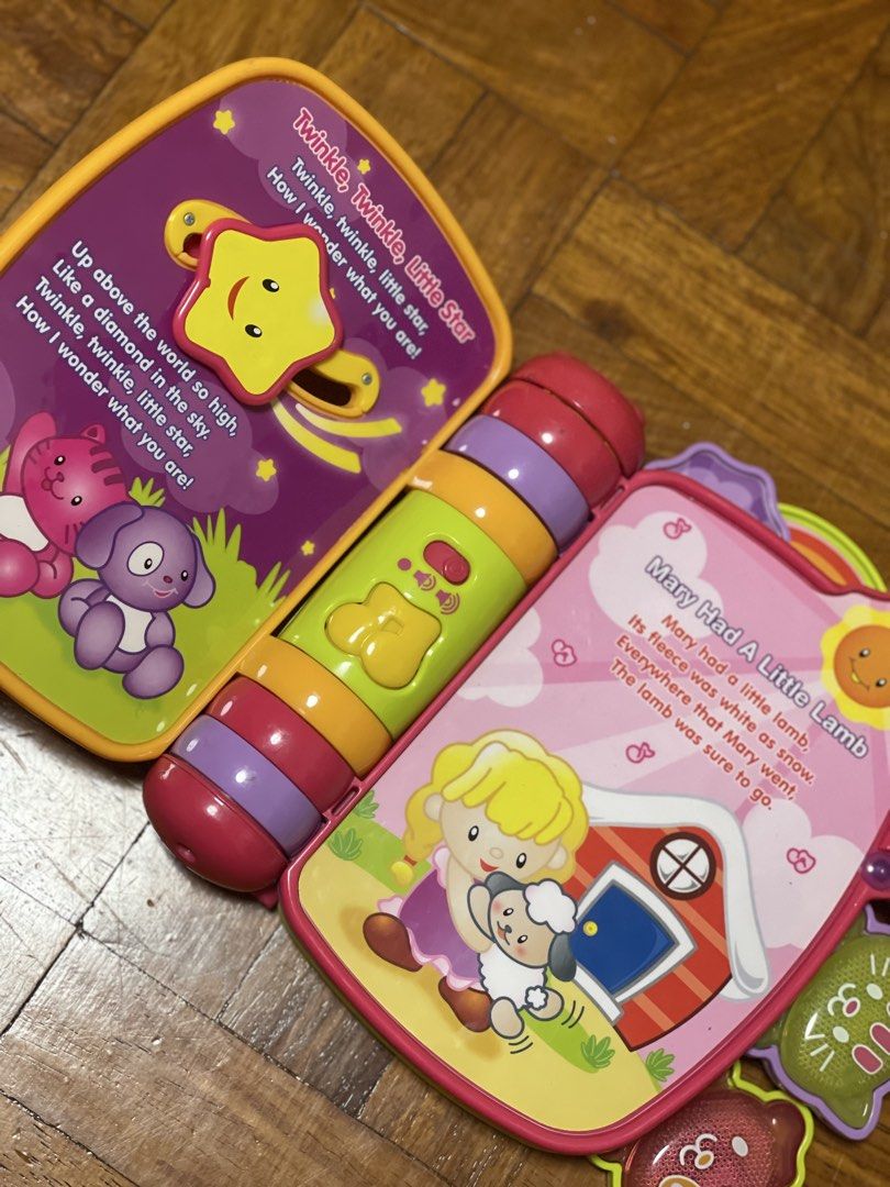 VTech Interactive Rhyme & Discover Book - Musical Learning Toy (Category: Educational & Learning Toys) located in Pasay City. Submitted by theclutterfree (Listing ID 1445128178, Image 2). Description: - Interactive VTech Rhyme & Discover Book - Plays classic nursery rhymes: Twinkle Twinkle Little Star, Mary Had a Little Lamb, Three Little Kittens, Bingo - Features colorful buttons and engaging illustrations - Encourages learning of rhymes and dev