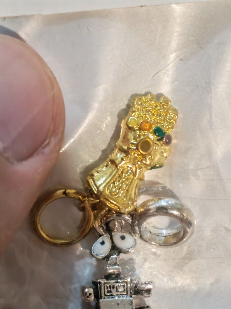 Wall-E and Infinity Gauntlet Charms with Rings (Category: Charms) located in Manila. Submitted by GentleGiant (Listing ID 1445207382, Image 3). Description: Charm wall e and pendant gauntlet 300 each Both for 500.