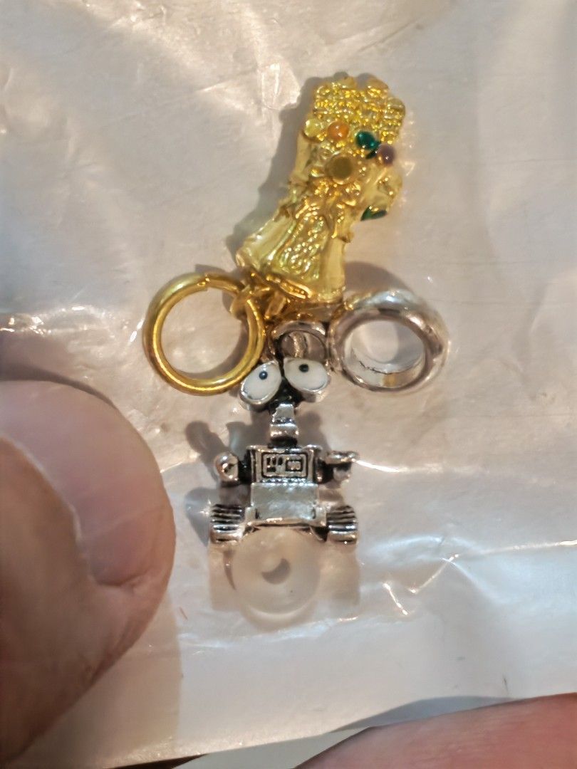 Wall-E and Infinity Gauntlet Charms with Rings (Category: Charms) located in Manila. Submitted by GentleGiant (Listing ID 1445207382, Image 1). Description: Charm wall e and pendant gauntlet 300 each Both for 500.