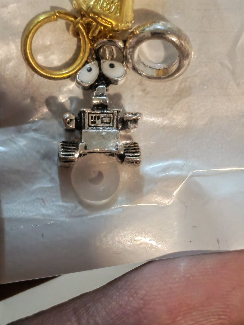 Wall-E and Infinity Gauntlet Charms with Rings (Category: Charms) located in Manila. Submitted by GentleGiant (Listing ID 1445207382, Image 2). Description: Charm wall e and pendant gauntlet 300 each Both for 500.