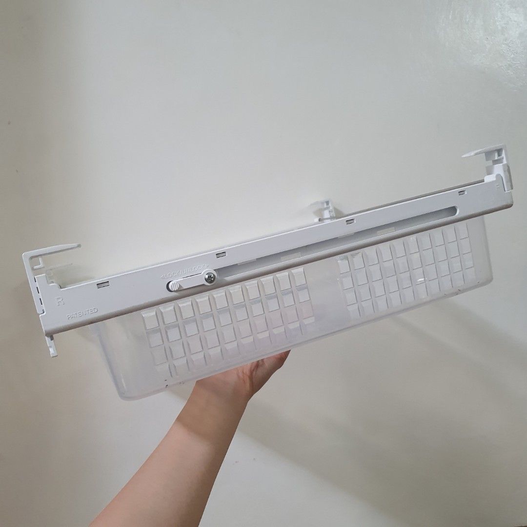 Under shelf drawer Basket (Category: Storage Boxes & Baskets) located in Paranaque City. Submitted by cobien (Listing ID 1445221338, Image 3). Description: - Adjustable white frame with removable plastic basket. - Basket dimensions: 14 x 12.5 inches. - Frame dimensions: 33.5 x 37.5 cm. - Perfect organizer in the cabinet or refrigerator. - Features easy slide-in and slide-out functionality. - Built with sturdy construction for durability..