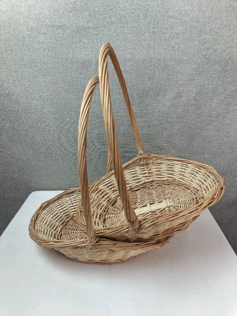 Wicker Basket with Handle - Set of 2 (Category: Storage Boxes & Baskets) located in Baguio. Submitted by rustyribbon (Listing ID 1445100713, Image 2). Description: - Set of two woven wicker baskets - Natural light brown color - Oval shape with tall, curved handles .