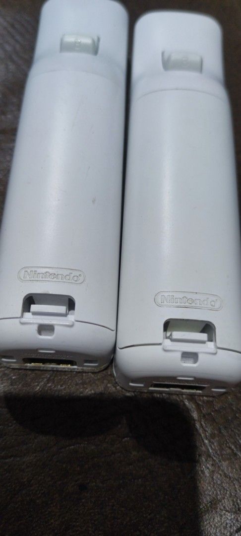 Wii Controllers Nintendo (Category: Controllers) located in Caloocan City. Submitted by crizelsant46867 (Listing ID 1445169881, Image 2). Description: Wii Controllers sold as set only (Nintendo Brand) * Tested using batteries only *Buy at your own risk po, no returns tayo Both white controllers are Nintendo, ewan lang sa black. #wii #gamecontroller .