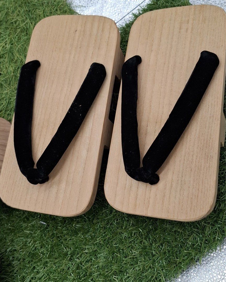 Wooden Geta Sandals with Black Straps (Category: Flats & Sandals) located in Quezon City. Submitted by eilgaraje (Listing ID 1445191048, Image 1). Description: - Traditional Japanese wooden sandals (Geta) - Features a raised wooden sole for comfort and style - Secured with comfortable black fabric straps - Perfect for cultural events, festivals, or adding a unique touch to everyday outfits - Available in multiple sizes to ensure a great fit.